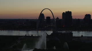 5.7K aerial stock footage approach Gateway Geyser and the Arch across the river, Downtown St. Louis, Missouri, twilight Aerial Stock Footage | DX0001_000761