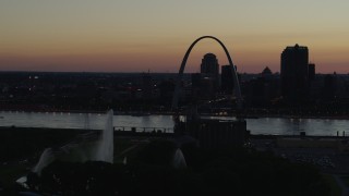 DX0001_000762 - 5.7K aerial stock footage flyby Gateway Geyser with view of Downtown St. Louis, Missouri, twilight