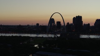 5.7K aerial stock footage of passing the Downtown St. Louis, Missouri skyline in silhouette at twilight Aerial Stock Footage | DX0001_000767