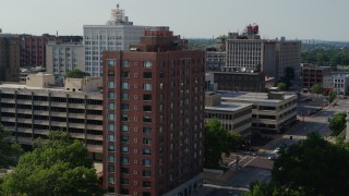 5.7K aerial stock footage of a stationary view of brick office building before approach in Downtown St. Louis, Missouri Aerial Stock Footage | DX0001_000801