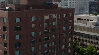 5.7K aerial stock footage of a slow approach to a brick office building in Downtown St. Louis, Missouri Aerial Stock Footage | DX0001_000802