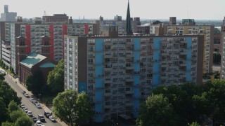 DX0001_000805 - 5.7K aerial stock footage of flying away from an apartment building in Downtown St. Louis, Missouri