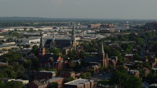 5.7K aerial stock footage of flying away from three brick churches in St. Louis, Missouri Aerial Stock Footage | DX0001_000826