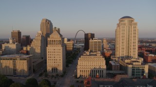 5.7K aerial stock footage flyby the courthouse buildings to reveal Arch and museum at sunset, Downtown St. Louis, Missouri Aerial Stock Footage | DX0001_000852