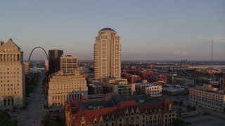 5.7K aerial stock footage flyby courthouse buildings to reveal the Arch at sunset, Downtown St. Louis, Missouri Aerial Stock Footage | DX0001_000859