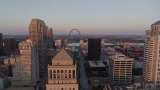 5.7K aerial stock footage approach a courthouse and rise to reveal Arch and museum at sunset, Downtown St. Louis, Missouri Aerial Stock Footage | DX0001_000867