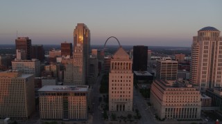 5.7K aerial stock footage flyby city hall and courthouses to reveal museum and Arch at sunset, Downtown St. Louis, Missouri Aerial Stock Footage | DX0001_000870