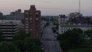 5.7K aerial stock footage of passing an office building and an empty street at twilight, Downtown St. Louis, Missouri Aerial Stock Footage | DX0001_000878