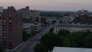 5.7K aerial stock footage flyby brick office building to reveal light street traffic at twilight, Downtown St. Louis, Missouri Aerial Stock Footage | DX0001_000880