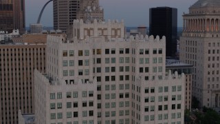 5.7K aerial stock footage of circling the top of a downtown apartment building at twilight, Downtown St. Louis, Missouri Aerial Stock Footage | DX0001_000888