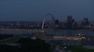 DX0001_000896 - 5.7K aerial stock footage of the famous Gateway Arch at twilight, visible from across the Mississippi River, Downtown St. Louis, Missouri