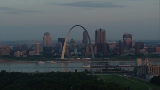 5.7K aerial stock footage of a view of the Gateway Arch by the Mississippi River at sunrise in Downtown St. Louis, Missouri Aerial Stock Footage | DX0001_000937