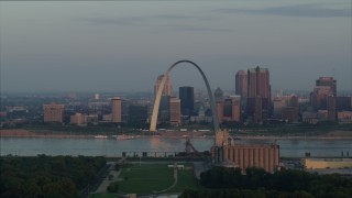 5.7K aerial stock footage of the St. Louis Arch beside the river at sunrise in Downtown St. Louis, Missouri Aerial Stock Footage | DX0001_000942