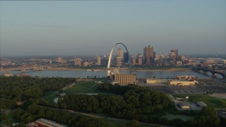 DX0001_000962 - 5.7K aerial stock footage flyby grain elevator with view of the Gateway Arch in the morning, Downtown St. Louis, Missouri