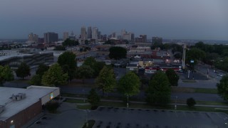 5.7K aerial stock footage of a view of skyline at twilight while descending to parking lot, Downtown Kansas City, Missouri Aerial Stock Footage | DX0001_000980