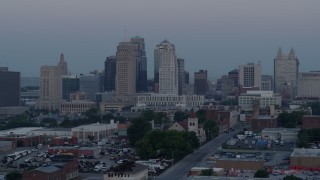 5.7K aerial stock footage of passing the city's tall skyscrapers at twilight in Downtown Kansas City, Missouri Aerial Stock Footage | DX0001_000983