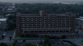 5.7K aerial stock footage of orbiting around a brick office building at sunrise in Kansas City, Missouri Aerial Stock Footage | DX0001_000991