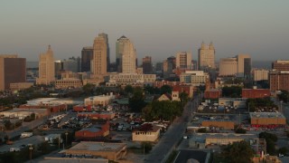 5.7K aerial stock footage of flying by the city skyline at sunrise, Downtown Kansas City, Missouri Aerial Stock Footage | DX0001_001003