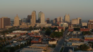 5.7K aerial stock footage flyby the city skyline at sunrise, seen from an industrial area, Downtown Kansas City, Missouri Aerial Stock Footage | DX0001_001005