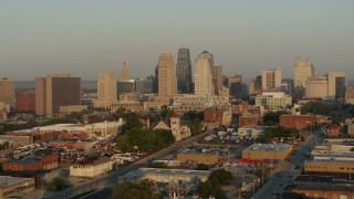 5.7K aerial stock footage of flying east away from the city skyline at sunrise, Downtown Kansas City, Missouri Aerial Stock Footage | DX0001_001012