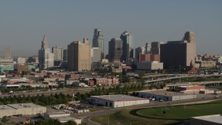 5.7K aerial stock footage of flying by the city's skyline from east of the freeway in Downtown Kansas City, Missouri Aerial Stock Footage | DX0001_001058