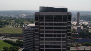 5.7K aerial stock footage of circling the top of a Crown Center office building in Kansas City, Missouri Aerial Stock Footage | DX0001_001096