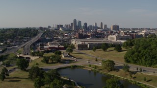 5.7K aerial stock footage descend and fly away from government office building and city skyline, Downtown Kansas City, Missouri Aerial Stock Footage | DX0001_001125