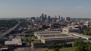 5.7K aerial stock footage of flying away from a government building and city's skyline, Downtown Kansas City, Missouri Aerial Stock Footage | DX0001_001130