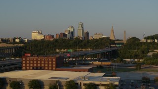 5.7K aerial stock footage flyby freeway with light traffic with view of skyline at sunset in Downtown Kansas City, Missouri Aerial Stock Footage | DX0001_001165