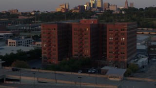 5.7K aerial stock footage orbit around a brick office building at twilight in Kansas City, Missouri Aerial Stock Footage | DX0001_001173