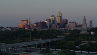 5.7K aerial stock footage of city high-rises reflecting the setting sun in Downtown Kansas City, Missouri, twilight Aerial Stock Footage | DX0001_001178