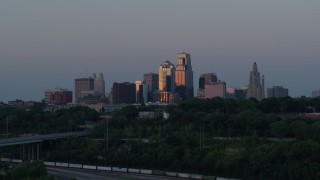 5.7K aerial stock footage the city's skyline lit by the setting sun in Downtown Kansas City, Missouri, twilight Aerial Stock Footage | DX0001_001190