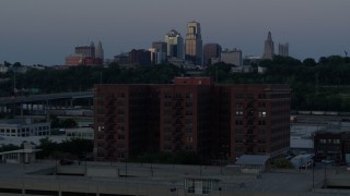 5.7K aerial stock footage reverse and static view of brick building and skyline at twilight, Downtown Kansas City, Missouri Aerial Stock Footage | DX0001_001200