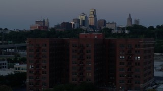 5.7K aerial stock footage fly over brick building, approach skyline at twilight, Downtown Kansas City, Missouri Aerial Stock Footage | DX0001_001201