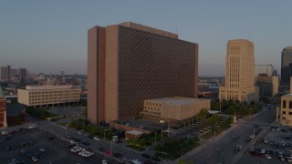 5.7K aerial stock footage approach a government building at sunrise, Downtown Kansas City, Missouri Aerial Stock Footage | DX0001_001204