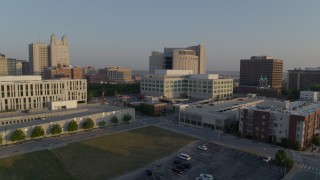 5.7K aerial stock footage reverse view of federal courthouse and government offices at sunrise, Downtown Kansas City, Missouri Aerial Stock Footage | DX0001_001217