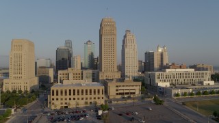 5.7K aerial stock footage passing city hall and neighboring skyscraper at sunrise, Downtown Kansas City, Missouri Aerial Stock Footage | DX0001_001223