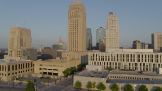 5.7K aerial stock footage ascend and orbit city hall and neighboring skyscraper at sunrise, Downtown Kansas City, Missouri Aerial Stock Footage | DX0001_001224