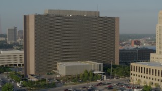 DX0001_001236 - 5.7K aerial stock footage of a static view of a government office building at sunrise, Downtown Kansas City, Missouri