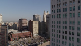 5.7K aerial stock footage flyby a group of city skyscrapers at sunrise, Downtown Kansas City, Missouri Aerial Stock Footage | DX0001_001275