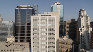 5.7K aerial stock footage of flying away from a downtown office building at sunrise, Downtown Kansas City, Missouri Aerial Stock Footage | DX0001_001279