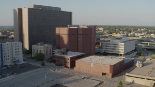 DX0001_001341 - 5.7K aerial stock footage of orbiting a city prison in Downtown Kansas City, Missouri