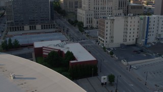 5.7K aerial stock footage of three cars stopped at a light at sunset in Downtown Kansas City, Missouri Aerial Stock Footage | DX0001_001343