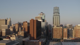 5.7K aerial stock footage of the setting sun shining on city skyscrapers in Downtown Kansas City, Missouri Aerial Stock Footage | DX0001_001347