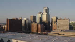 5.7K aerial stock footage of the setting sun shining on downtown skyscrapers in Downtown Kansas City, Missouri Aerial Stock Footage | DX0001_001348