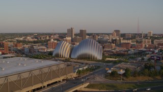 5.7K aerial stock footage fly away from concert hall, pass convention center at sunset in Downtown Kansas City, Missouri Aerial Stock Footage | DX0001_001350