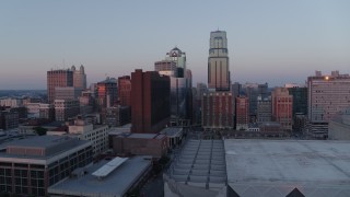 5.7K aerial stock footage ascend and pass by tall city skyscrapers at sunset in Downtown Kansas City, Missouri Aerial Stock Footage | DX0001_001365