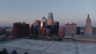 DX0001_001368 - 5.7K aerial stock footage flyby tall downtown skyscrapers near hotel at sunset in Downtown Kansas City, Missouri