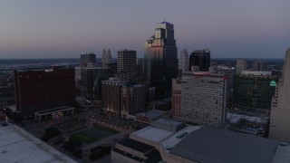 5.7K aerial stock footage of flying by tall city skyscrapers at twilight in Downtown Kansas City, Missouri Aerial Stock Footage | DX0001_001381