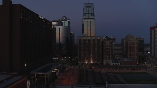 5.7K aerial stock footage of skyscrapers between hotels and office buildings at twilight in Downtown Kansas City, Missouri Aerial Stock Footage | DX0001_001396